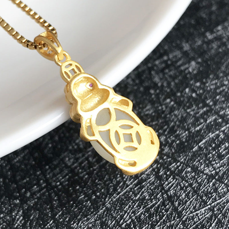 Gold Art Exquisite gold plated Hetian jade toad pendant - ruby embellishment and coin pattern, suitable for daily wear and gift giving